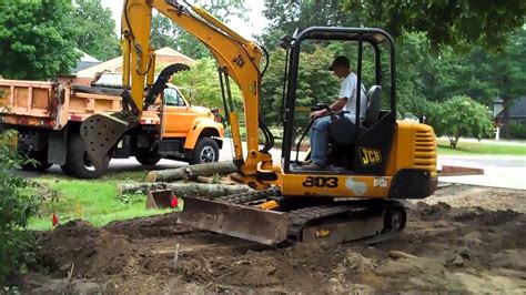 how to grade with a mini excavator|digging with an excavator.